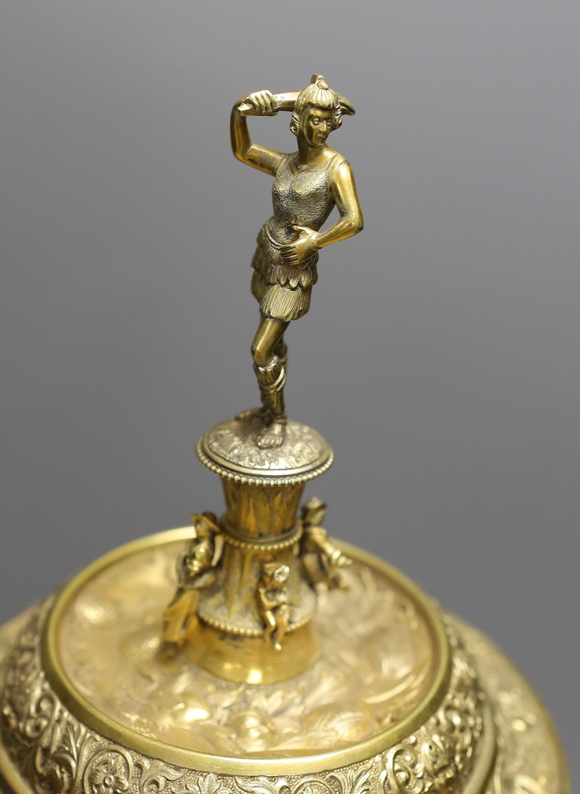 A decorative Bacchus electrotype chalice and cover on stone base - 49cm high